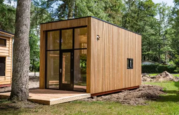 A wooden backyard office shed.