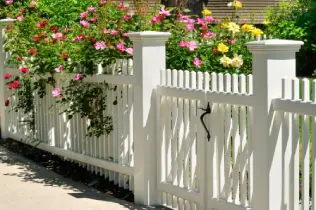picket fence covered in flowers
