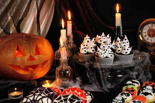DIY haunted halloween dining table setting for cookies and snacks.