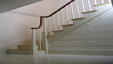 stairwell with drawer storage underneath