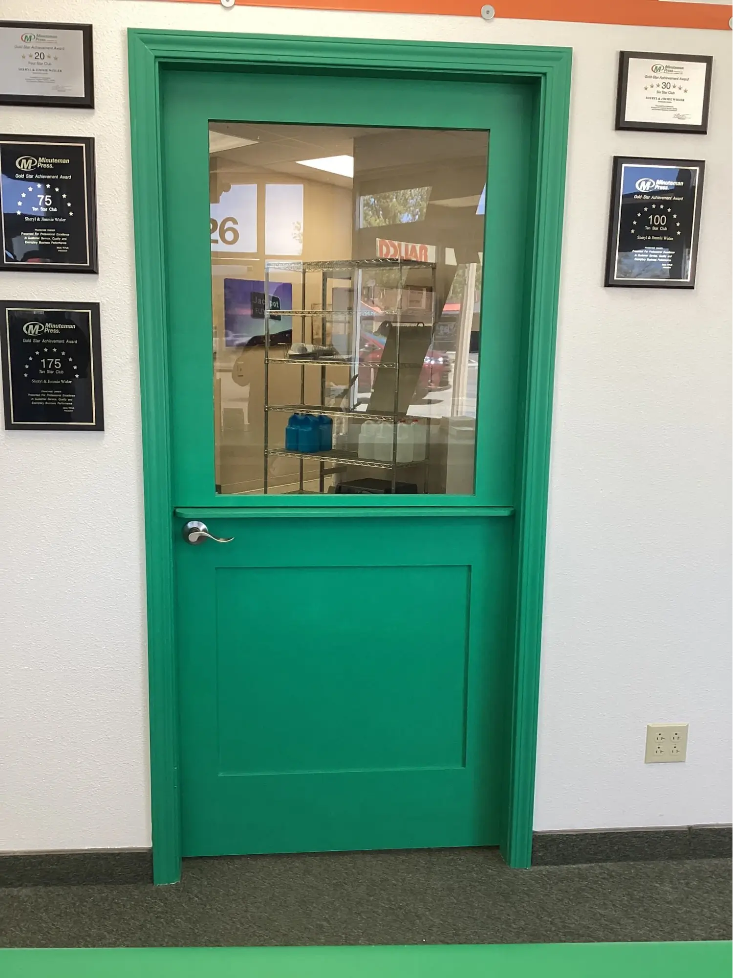 A client testimonial image of a green dutch door with a small shelf and a window.