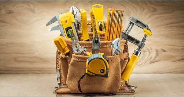 A carpenter's tool belt filled with tools.