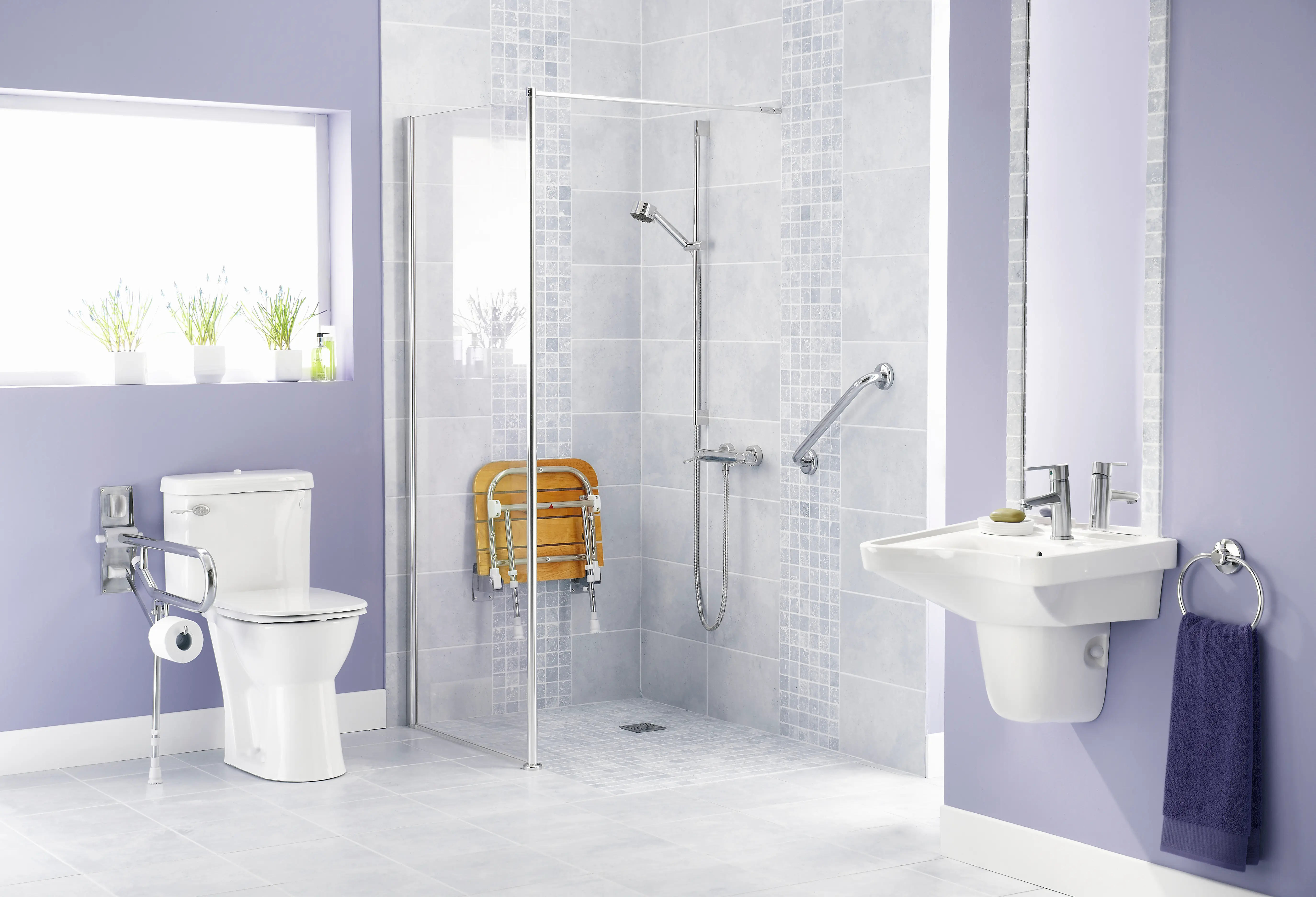 A large shower and bathroom with safety devices in place.