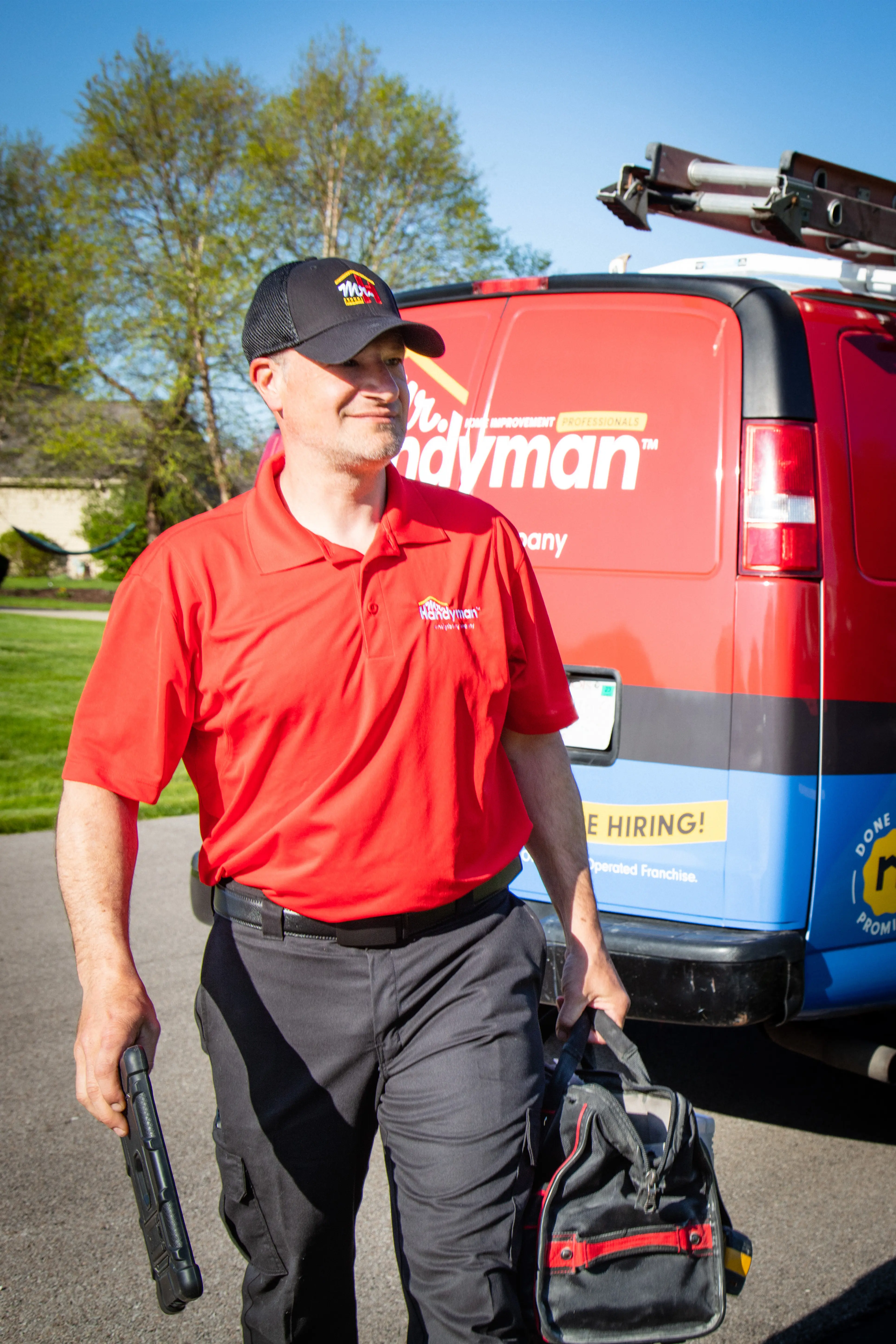 Mr. Handyman walking from service van to perform safety and mobility services in a customer's home.