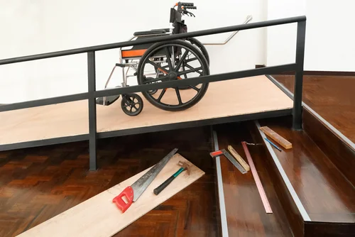 Wheelchair on wooden ramp.