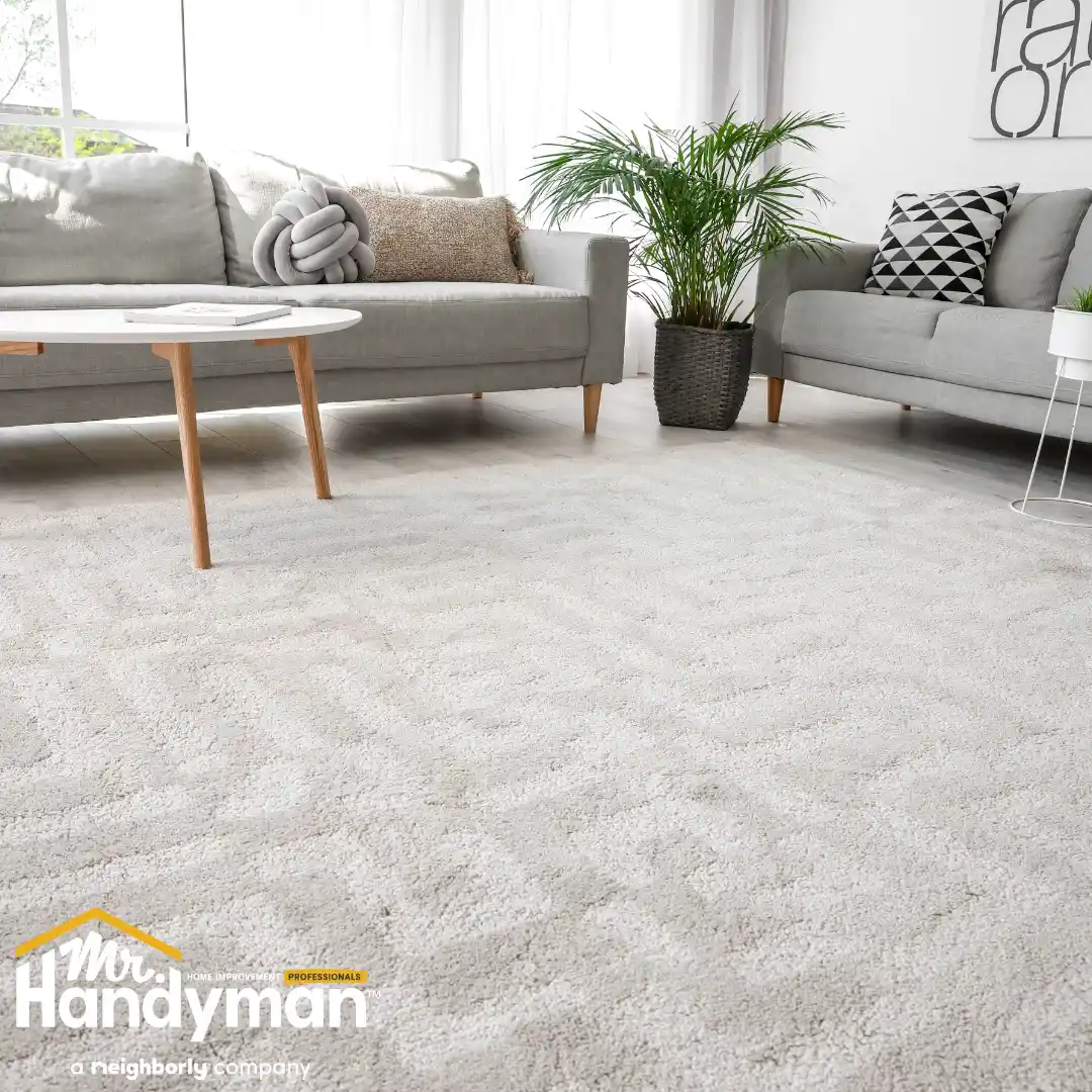 A cozy living room featuring two gray sofas, a round coffee table.