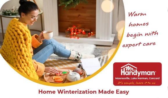 Woman sitting by fireplace with hot drink and snacks.