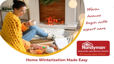 Woman sitting by fireplace with hot drink and snacks.