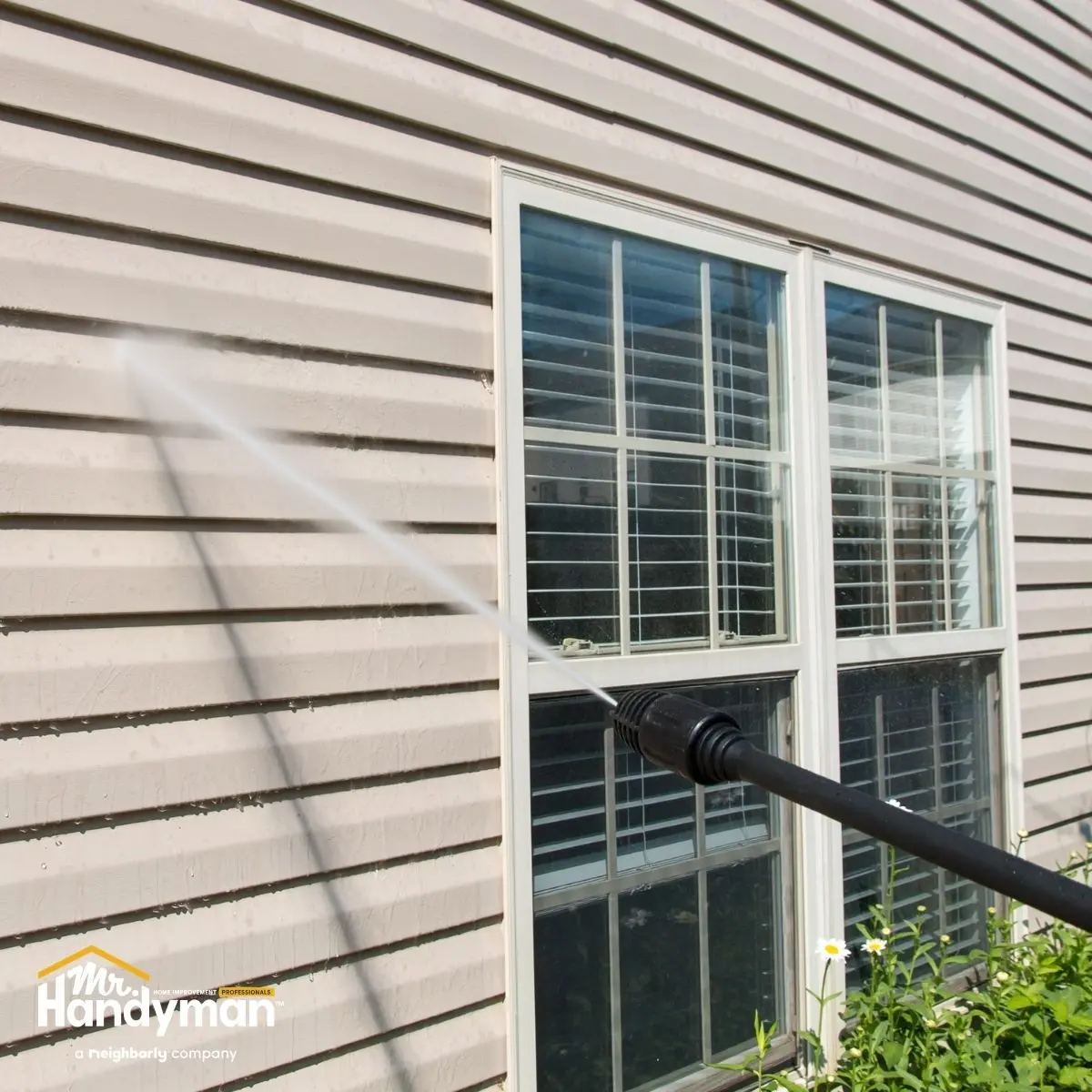 Washing the walls near the window.