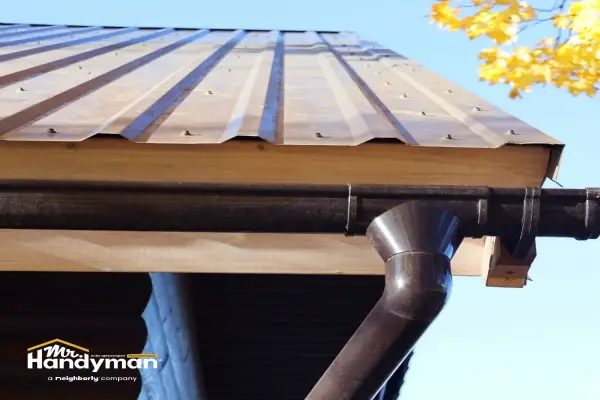 Mr. Handyman technician performing spring home maintenance inspection at Wichita area home