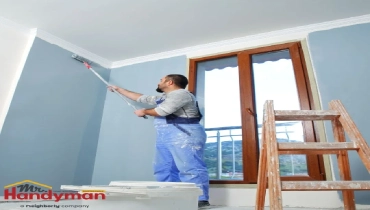 Mr. Handyman carpenter installing crown molding in a historic Charleston, South Carolina home interior