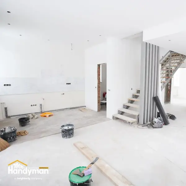 handyman installing flooring and finishing basement living space in Oklahoma City OK home