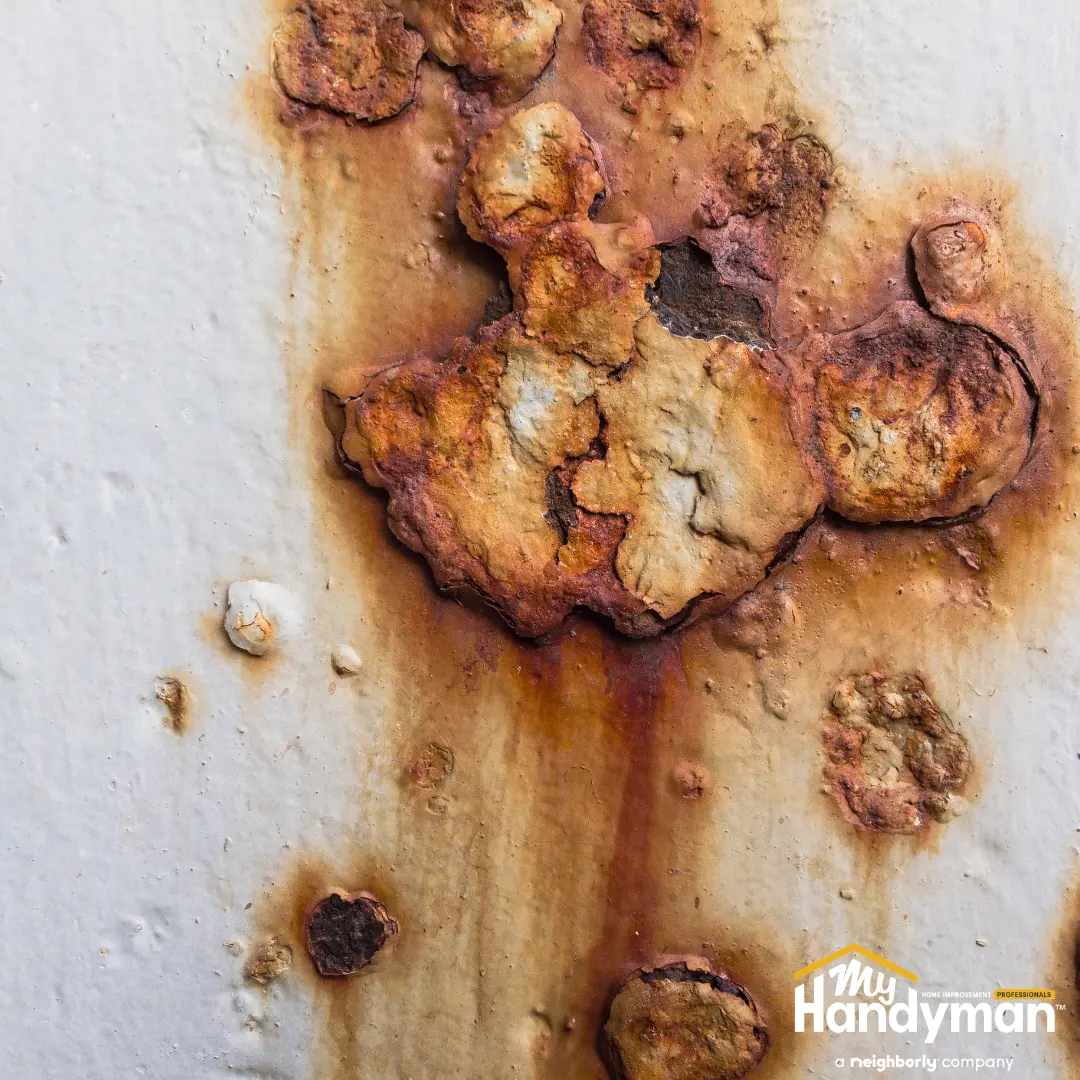 Close-up of rust and corrosion on a metal surface.