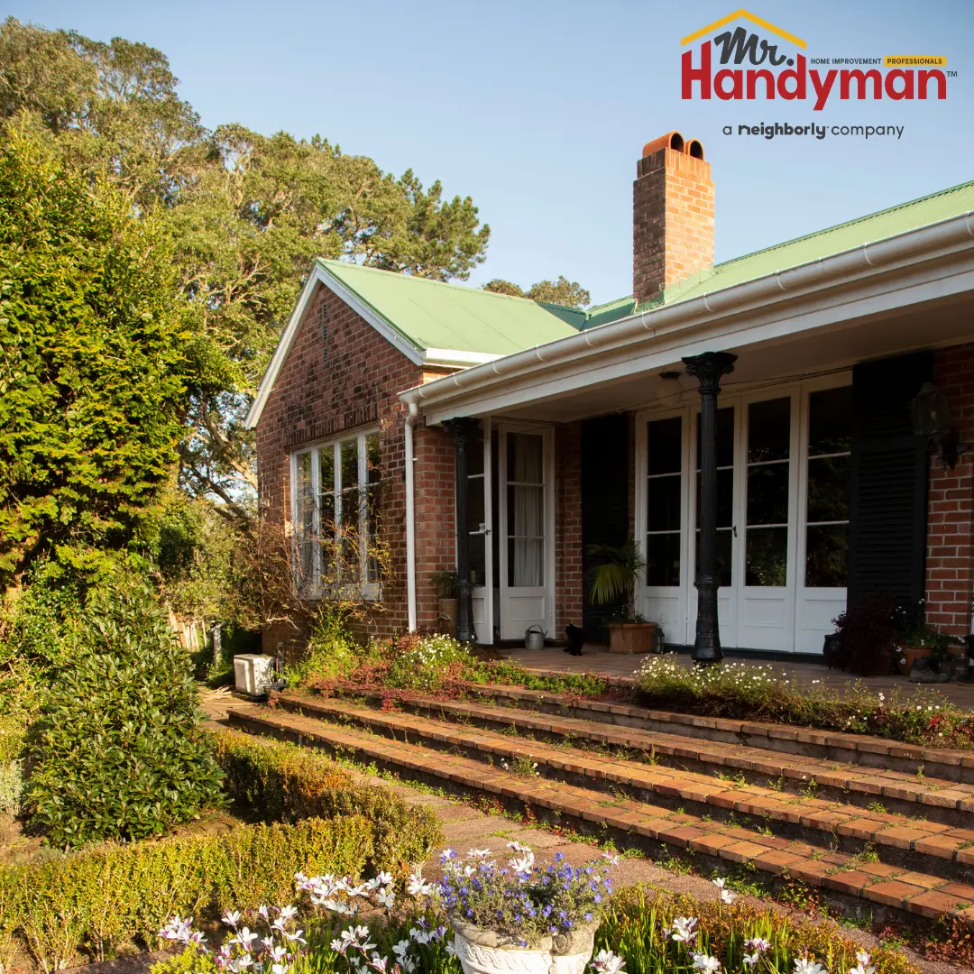 Exterior view of a brick house with a porch.