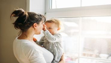 Family in front of single hung window.