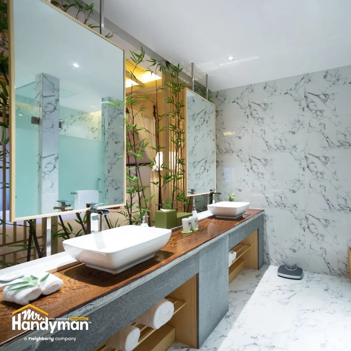 Modern bathroom with a double vanity, vessel sinks, and marbled walls.