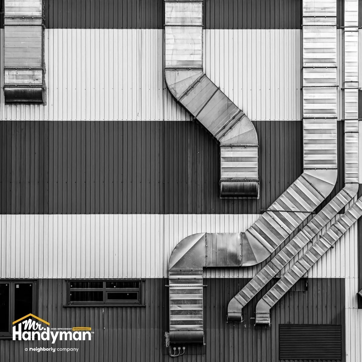 Industrial building  metal ductwork and horizontal striped wall panels