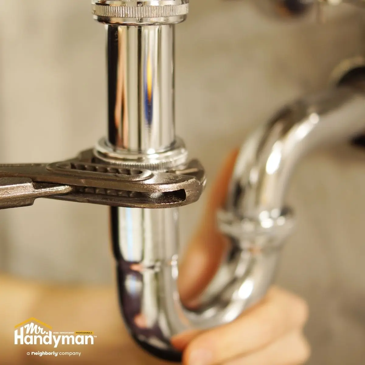 technician installing kitchen faucet