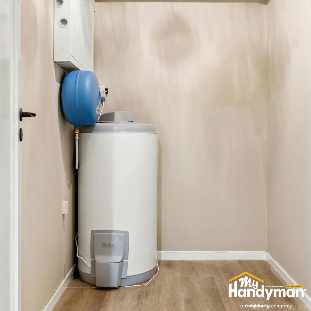 White water heater with a blue expansion tank.