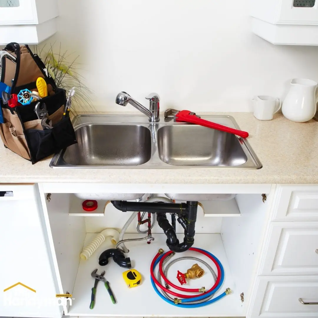 A kitchen sink area featuring a tool bag.