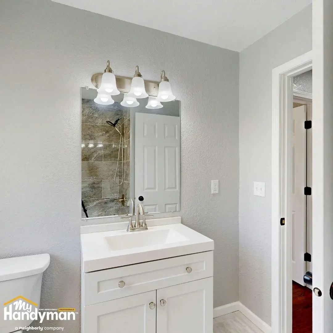 Bright bathroom featuring a modern white vanity.