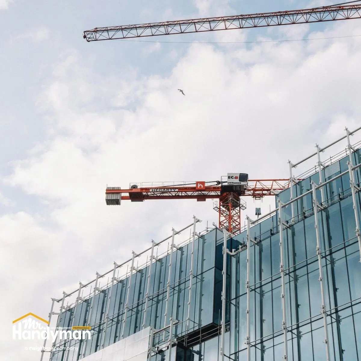 Construction site with a red crane.