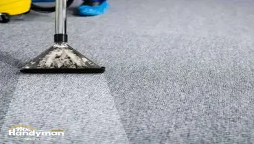 Mr. Handyman technician inspecting and repairing commercial gym flooring at a South Bend Northern Indiana fitness facility