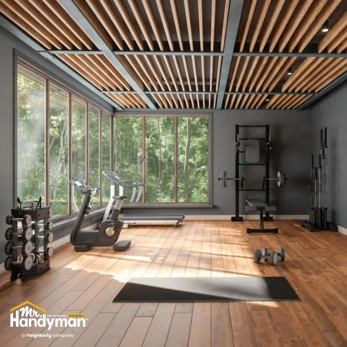 Modern home gym with large windows.
