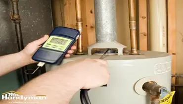 Handyman inspecting residential water heater in Martinsburg WV home