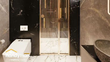 A modern bathroom featuring a glass shower enclosure.