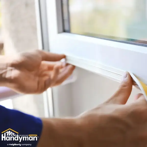 Mr. Handyman window sealing service.