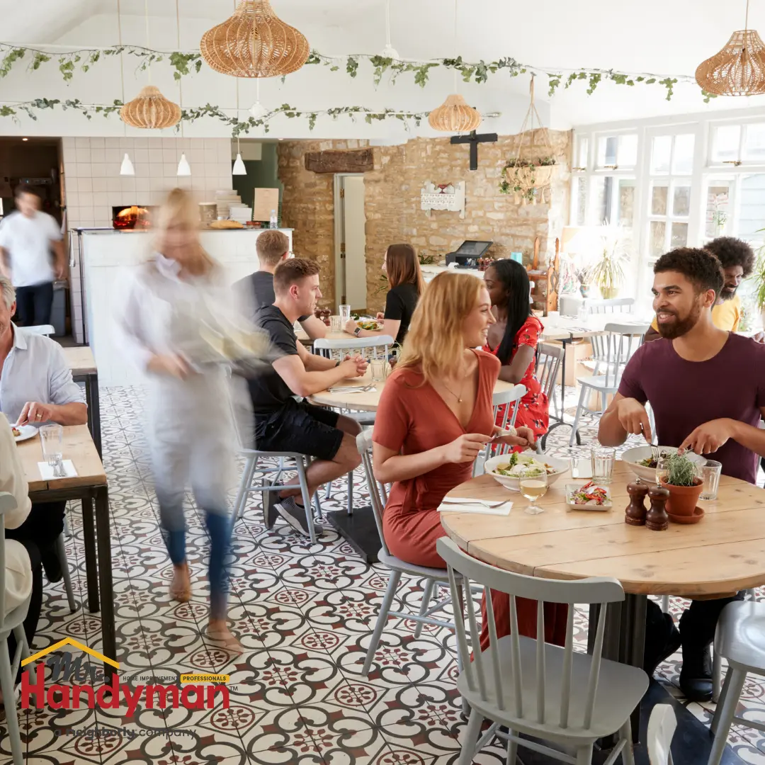 A bustling restaurant dining room filled with people.