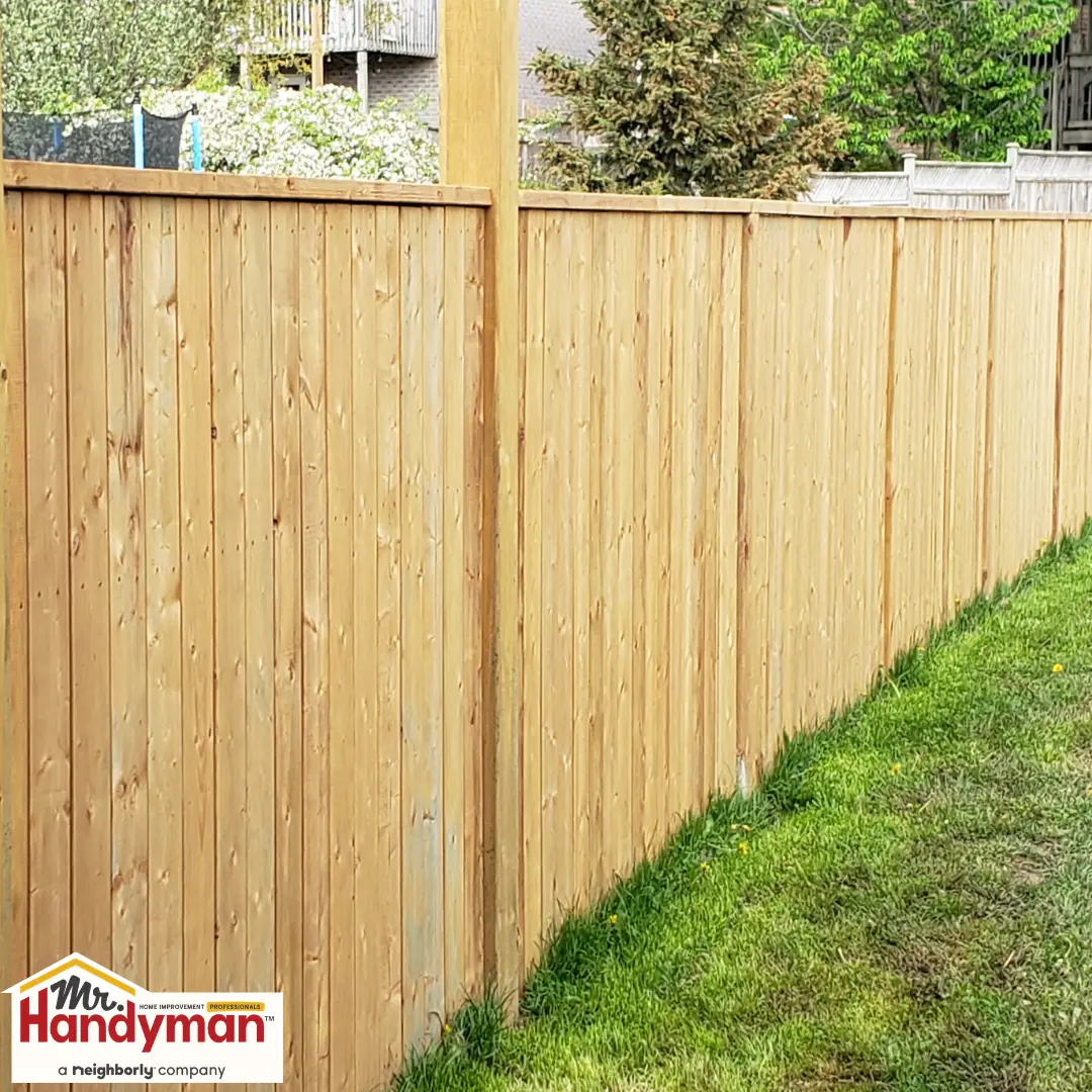 Newly installed wooden privacy fence.