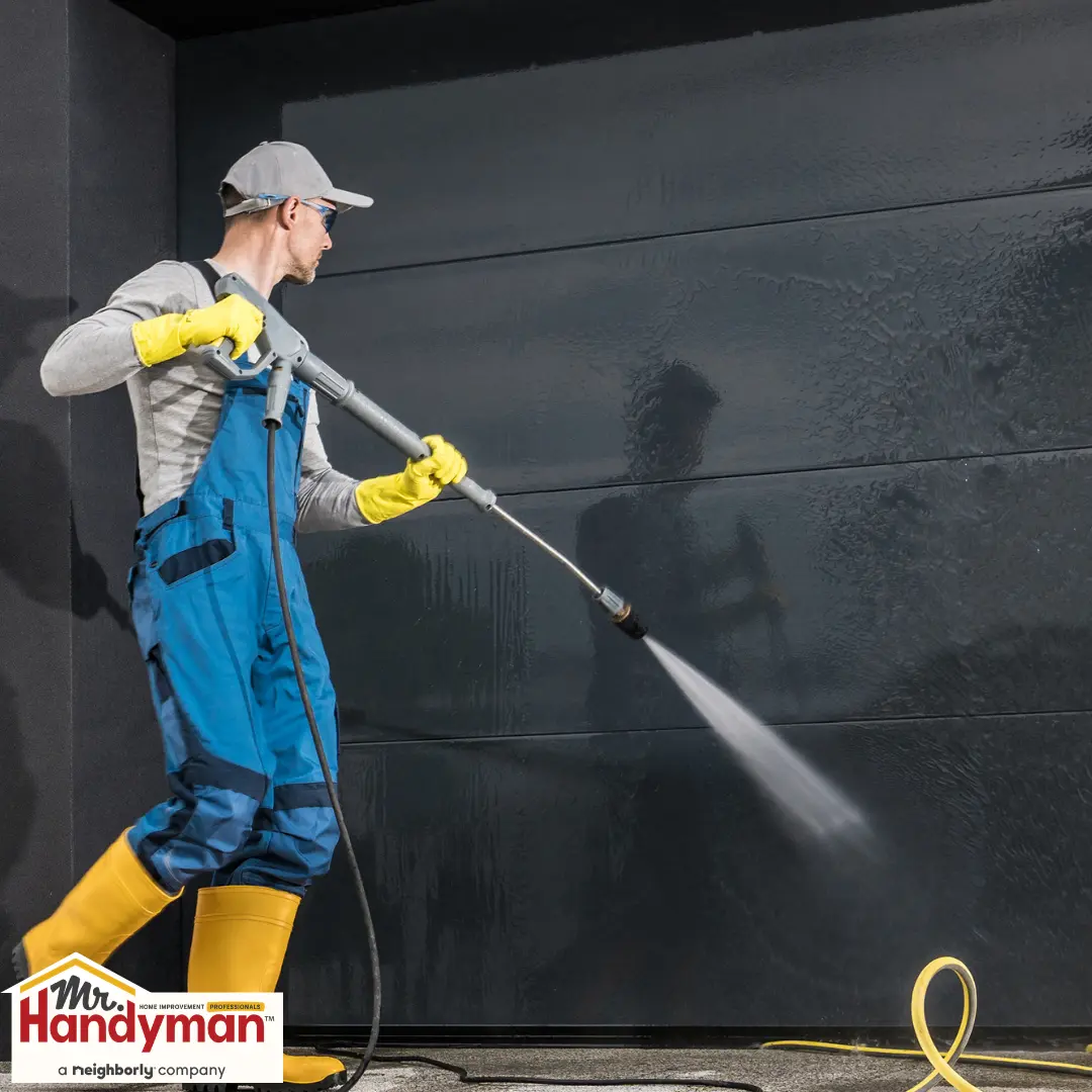 handyman painting a front door to boost curb appeal at a home in West Nashville Tennessee