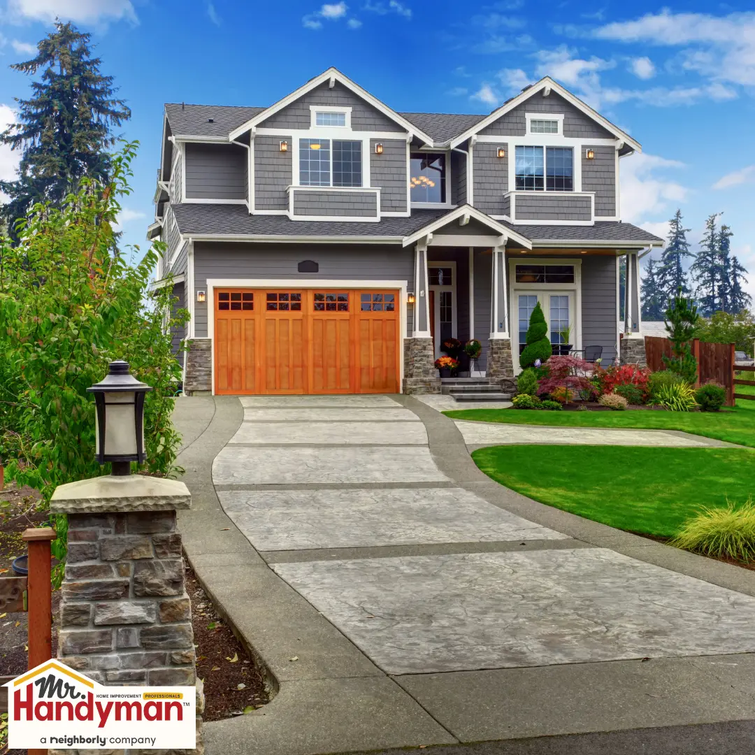 handyman painting a front door to boost curb appeal