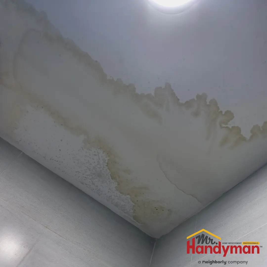 Handyman-repairing-a-commercial-entrance-door-closer-at-a-West-Nashville-business