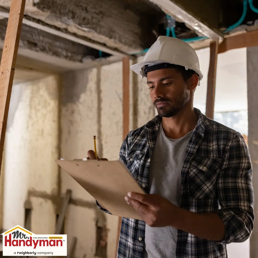 handyman reviewing a home remodeling plan with a homeowner in West Nashville Tennessee