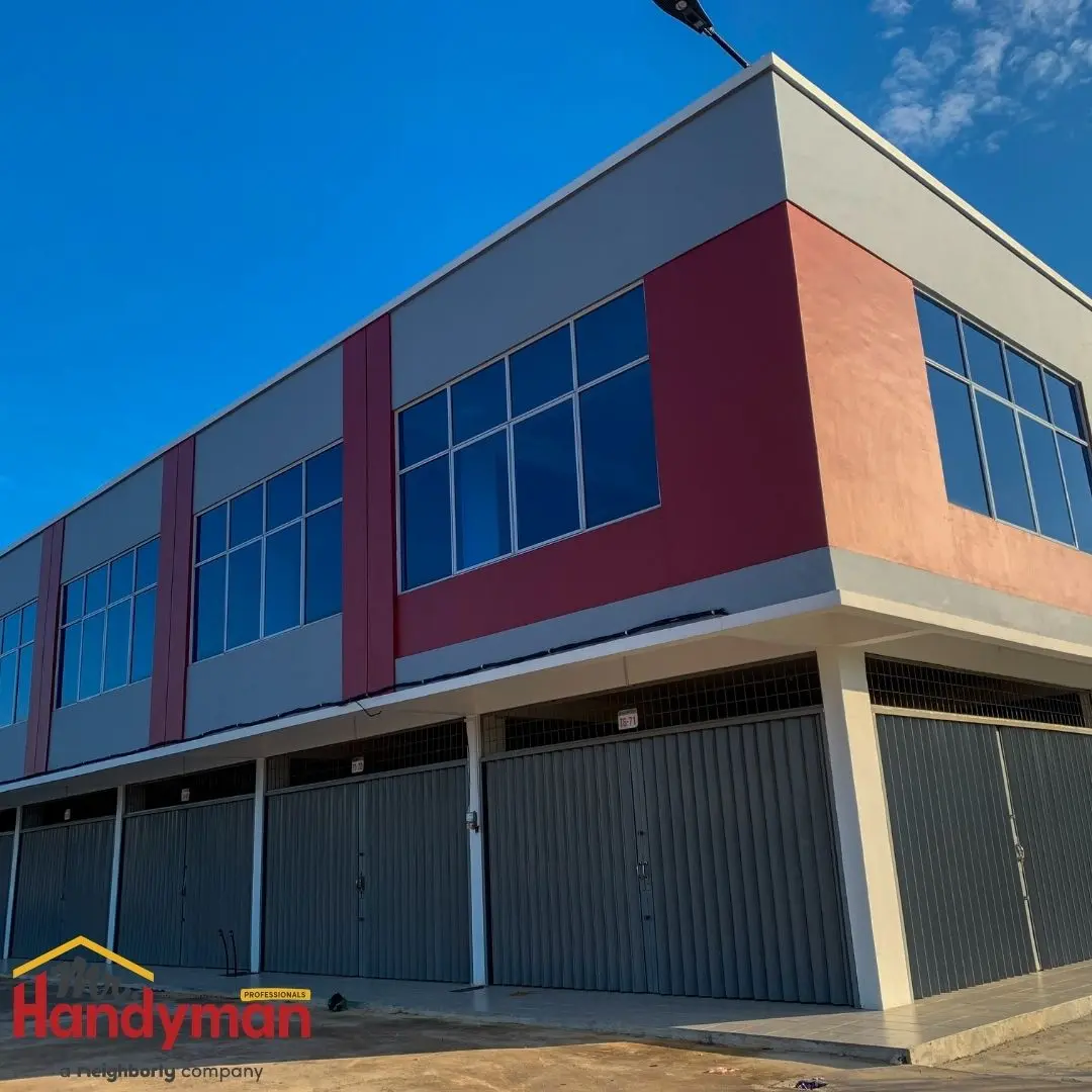 A two-story commercial building featuring large windows and a modern facade.