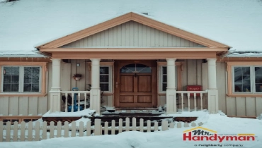 Mr. Handyman technician repairing exterior caulking and paint failure on a Plano, Texas home after winter.