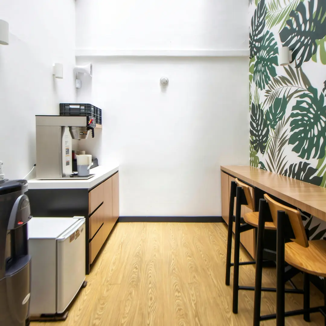 An office breakroom features a coffee maker counter.