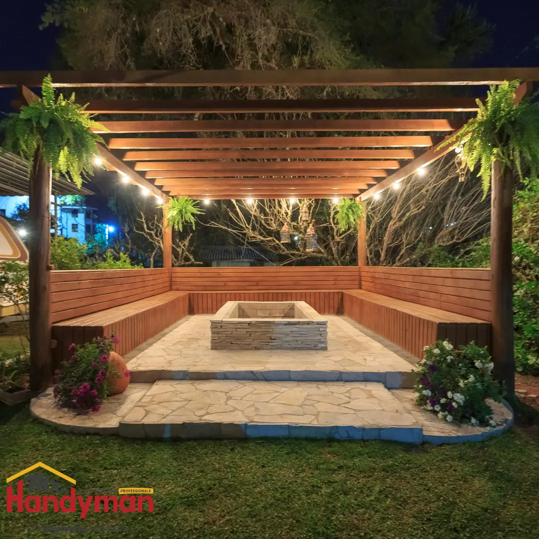 A backyard patio with a stone-lined fire pit in the center.