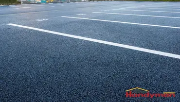 Handyman inspecting a commercial parking lot for safety hazards in Martinsburg West Virginia.