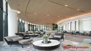 Modern lounge area featuring stylish furniture, elegant decor, and large windows.