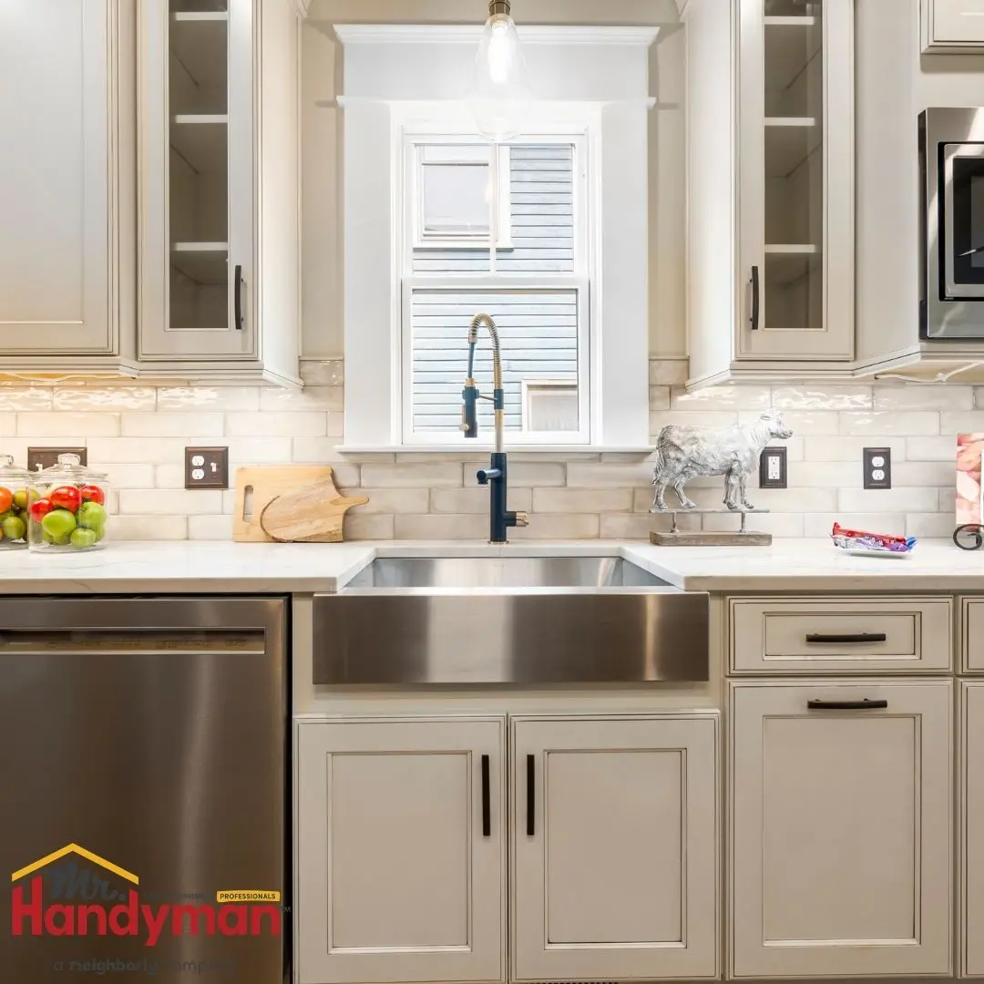 Modern kitchen featuring a sink, stylish faucet, and elegant cabinetry.