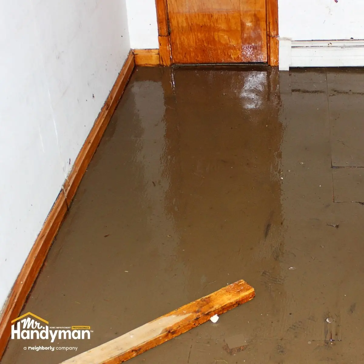 Flooded indoor floor with standing water.