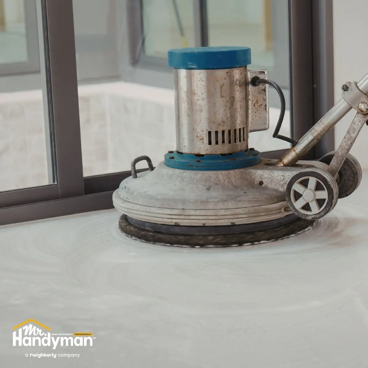 Close-up of a floor buffer scrubbing.
