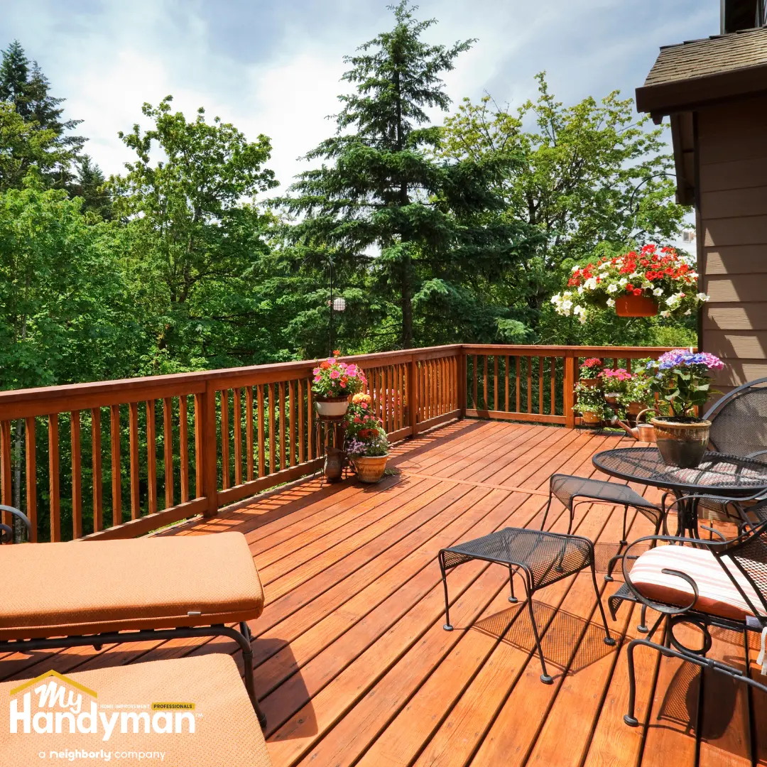Handyman installing deck lighting for summer outdoor entertaining at a home in Ann Arbor Michigan