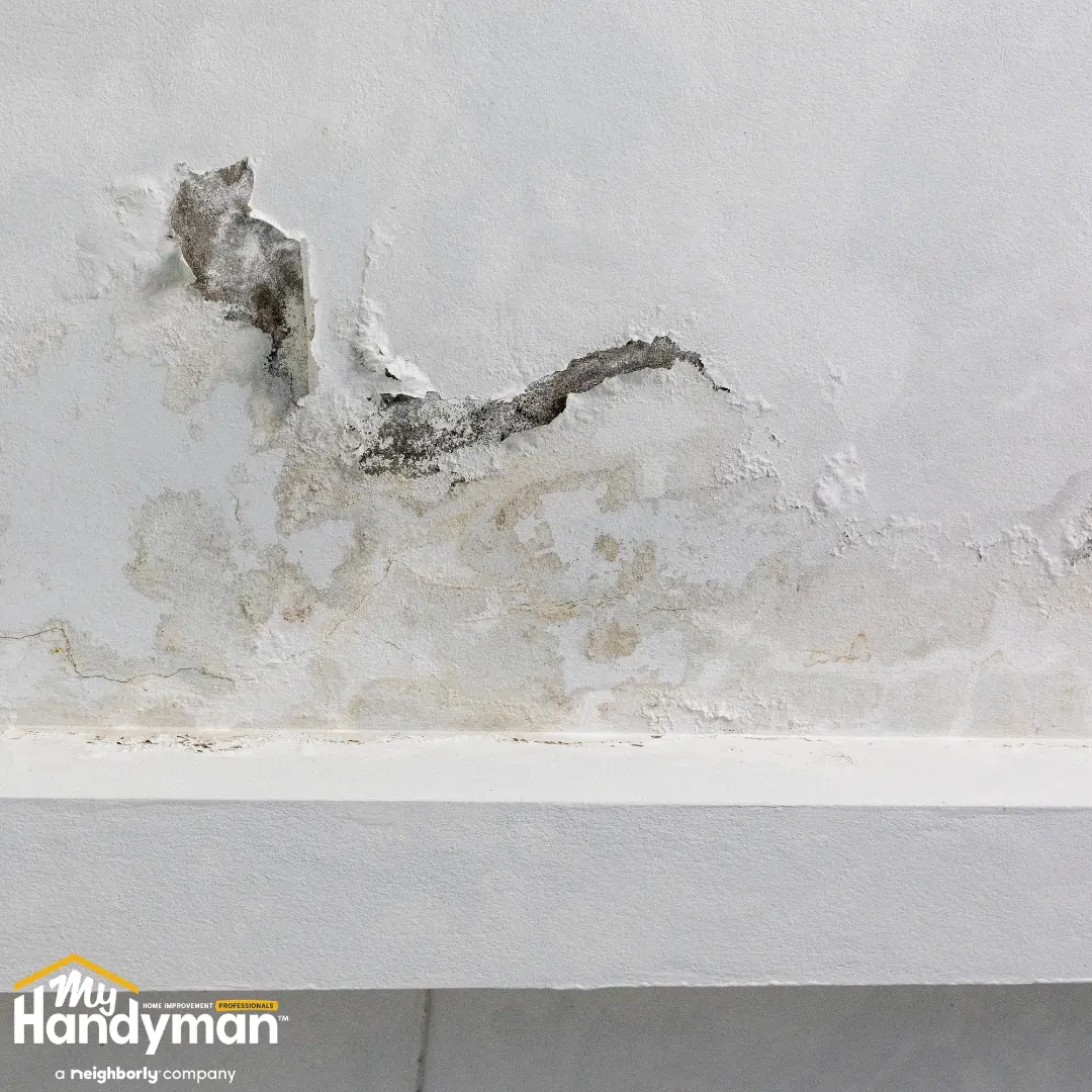 Handyman restoring a commercial entry floor and door hardware in Ann Arbor Michigan