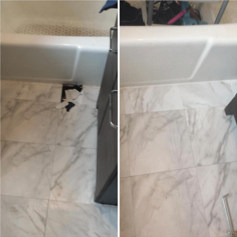 A cracked bathroom floor tile that has been repaired with professional service from Mr. Handyman