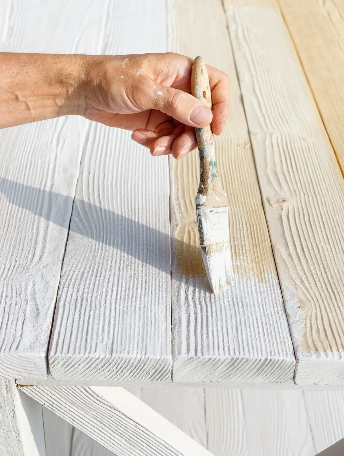 Mr. Handyman of Wheaton employee painting wood